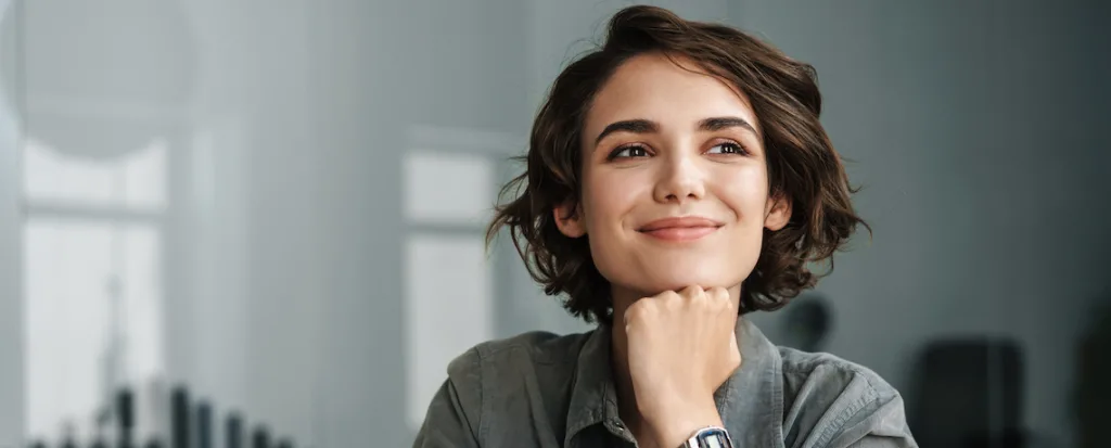 woman with head on hand thinking